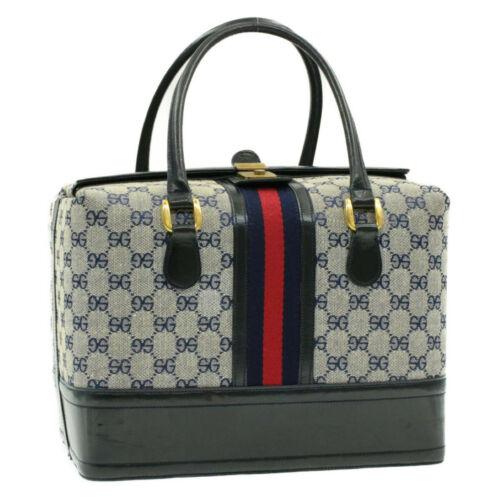 Authentic GUCCI Sherry Line GG Canvas Hand Bag Navy Red: This item qualifies for FREE DOMESTIC SHIPPING to customers in the USA Brand: GUCCI Size: W30 x H22 x D20cm(Approx) Color: Navy / Red Type: unknown Material: Canvas Department: Woman Style: Hand Bag E