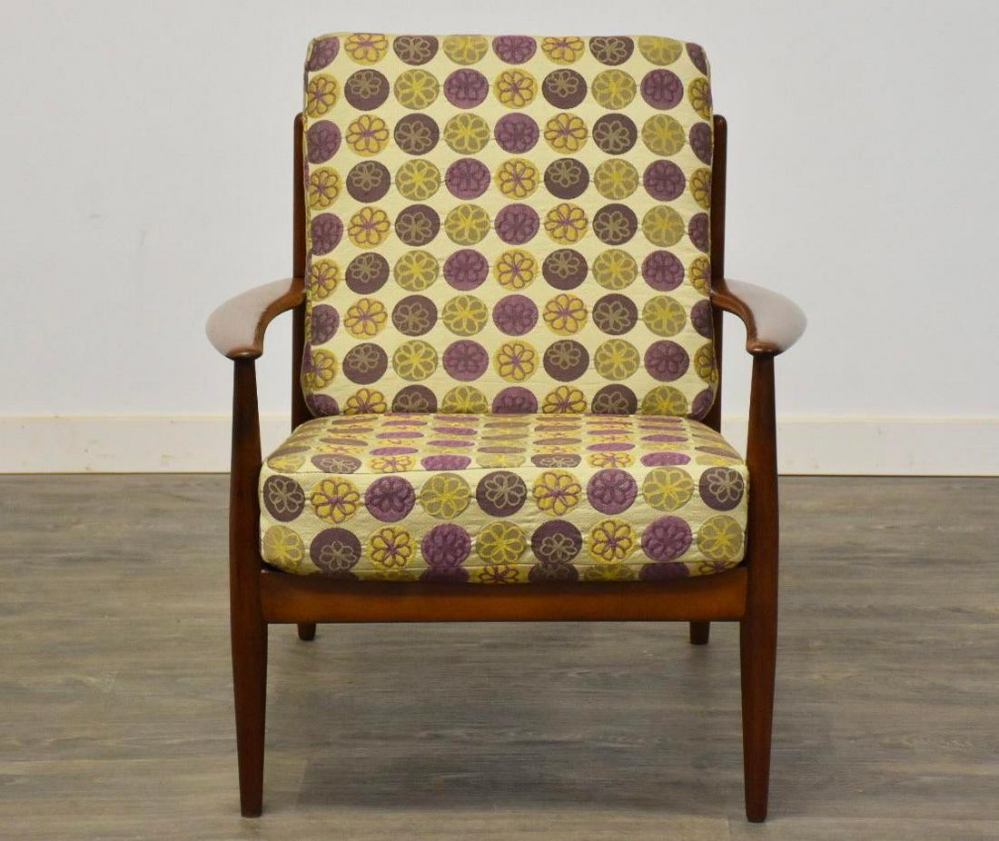 Danish Teak Lounge Chair by Grete Jalk: A mid century modern teak lounge chair with floral upholstery designed by Grete Jalk. New back straps shown. Seat height is 16.5 28.5 wide. 30 deep. 33 tall. Dimensions: 28.5W x 30D x 33H Styles: Mid-