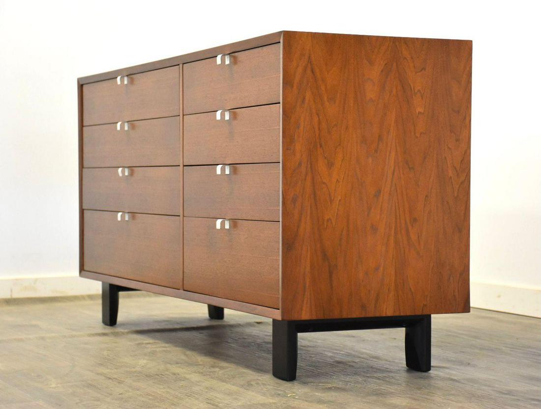 George Nelson Herman Miller Dresser: A mid century modern walnut dresser credenza with aluminum finger pulls designed by George Nelson for Herman Miller. Black lacquered legs. Professionally refinished. 57.25 wide. 18.5 deep. 29.5 tall.