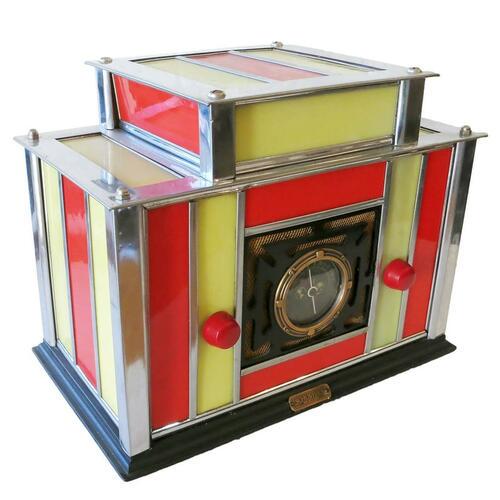 Machine Age Chrome and Stained Glass Radio by Radio-Glo: Rare stained glass and chromed steel AM radio by Radio-Glo with black painted wood base. This rarely seen radio is made of red and white stained glass panels held together by a chromed steel structure