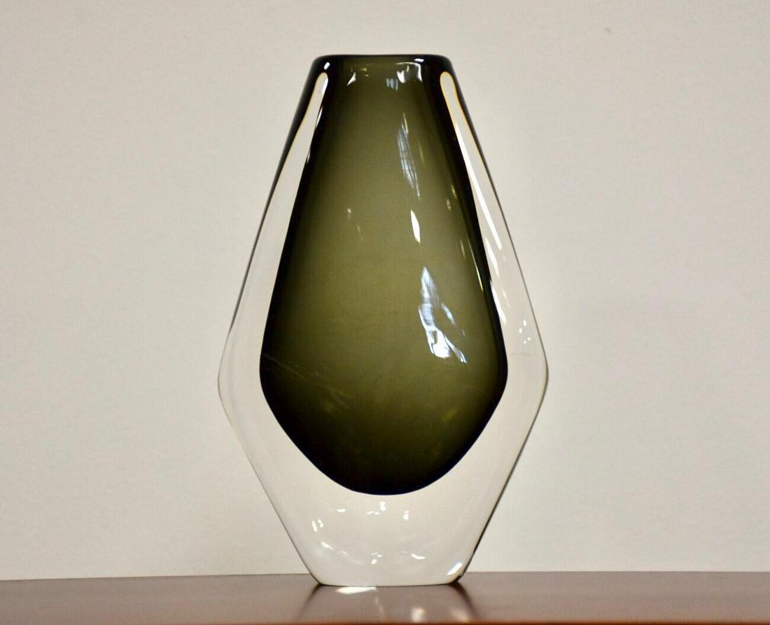 1960s Orrefors Swedish Glass Vase: A stunning mid century modern glass vase signed Orrefors. Made in Sweden. 5.25 wide. 2 deep. 8.5 tall. Dimensions: 5.25W x 2D x 8.5H Styles: Scandinavian Brand: Orrefors Period: 1960s Item Type: Vinta