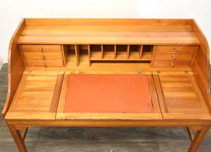 Andreas Hansen Danish Modern Desk: A mid century modern teak color desk made of pine designed by Andreas Hansen. Practical storage space under the top. Leather writing blot. Finished back. Writing height is 28.5. Knee hole is 23.75 tal