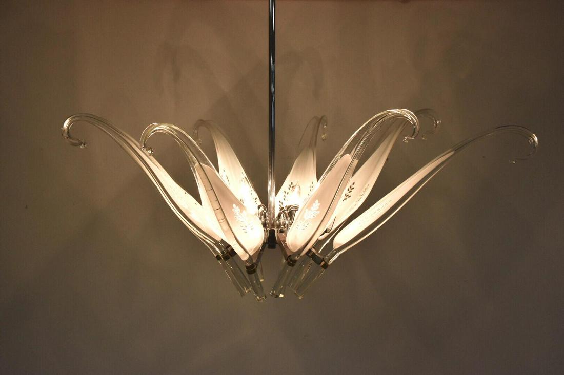 Franco Luce for Seguso Murano Blown Glass Chandelier: A beautiful brass and eight Italian Murano glass leaf chandelier designed by Franco Luce. All hand blown glass in excellent condition. No known chips cracks breaks etc. Dimensions: 39W x 39D x 34L Sty