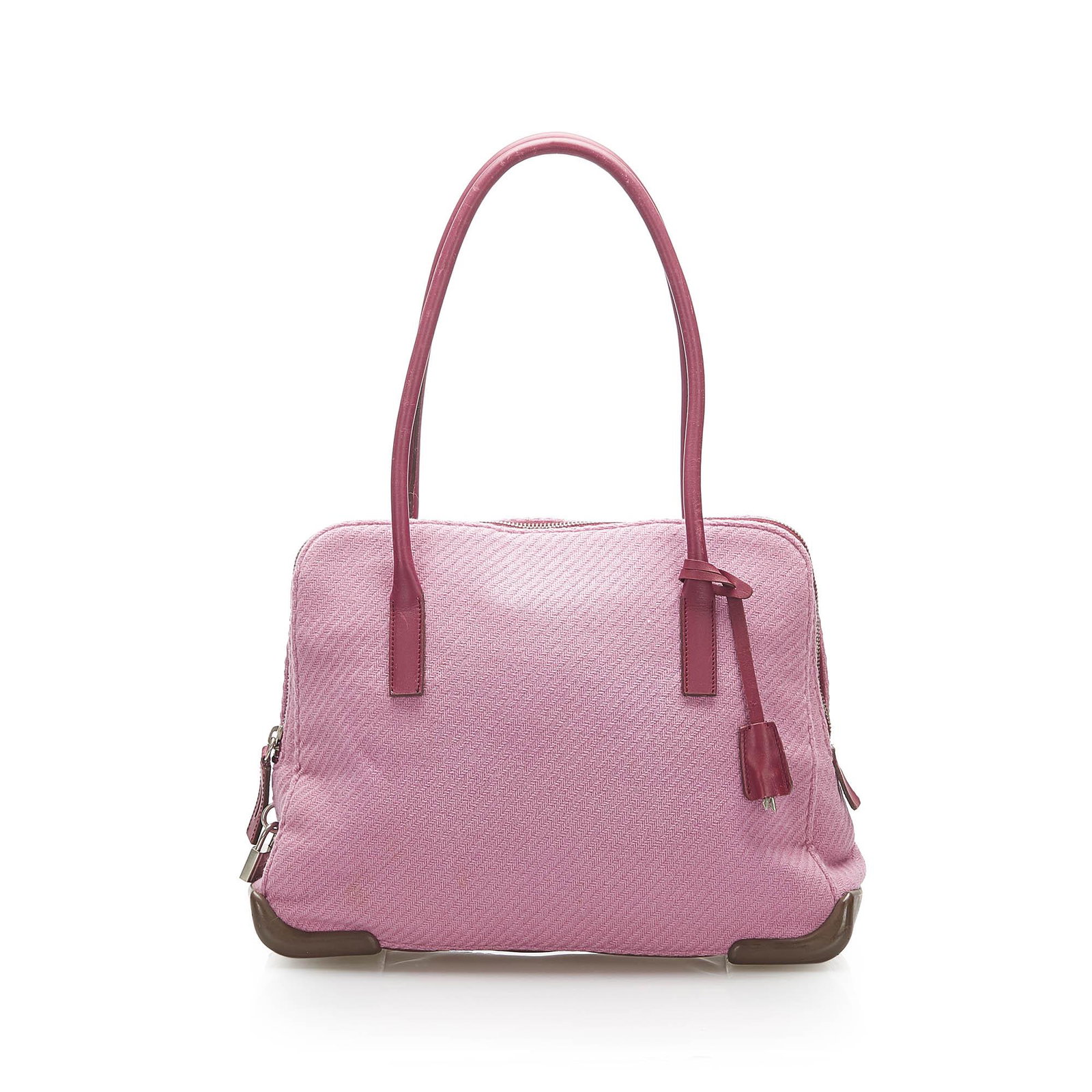 Authentic Prada Canvas Handbag: This item qualifies for FREE DOMESTIC SHIPPING to customers in the USA This handbag features a canvas body with leather trim rolled leather handles a top zip closure and an interior zip pocket. Brand: