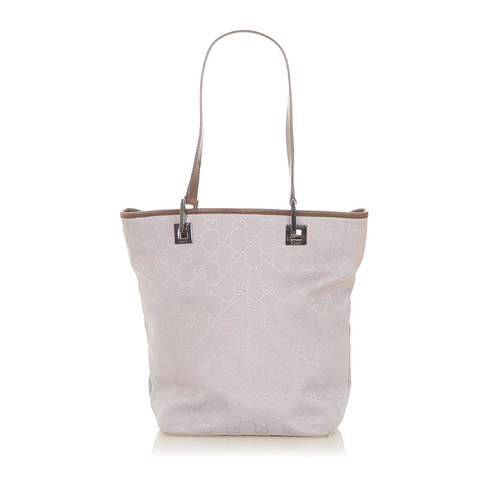 Gucci GG Canvas Tote Bag: Gucci GG Canvas Tote Bag This tote bag features a canvas body with leather trim flat leather straps an open top and an interior zip pocket. Brand: Gucci Model: GG Canvas Tote Bag Origin: Italy Categor