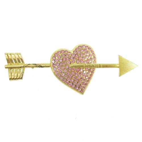 CHANEL CC Logos Rhinestone Bow And Arrow Heart Brooch: CHANEL CC Logos Rhinestone Bow And Arrow Heart Brooch Pin Corsage 02P Country/Region of Manufacture: France Theme: Logo Type: Brooch Color: Gold Main Stone: Rhinestone Metal: Gold-tone Brand: Chanel T