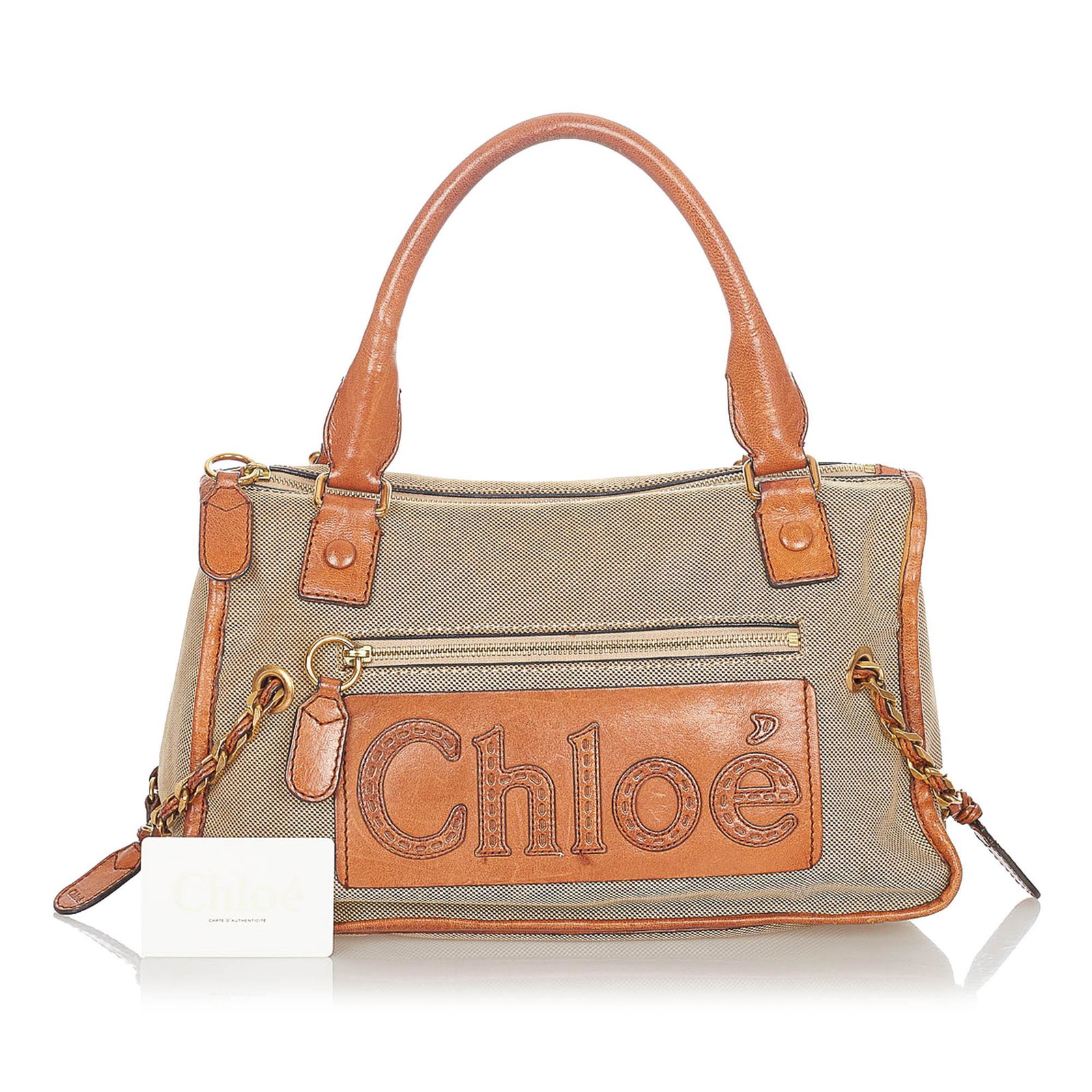 Chloe Haley Canvas Handbag: Chloe Haley Canvas Handbag The Haley handbag features canvas body with leather trim an exterior front zip pocket gold-tone chain link details rolled leather handles a top zip closure and an interior z