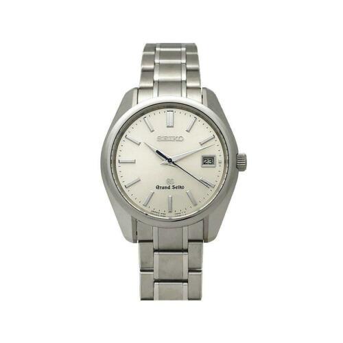 Grand Seiko SBGV005 9F62-0AA0 Quartz Date Display: Grand Seiko SBGV005 9F62-0AA0 Quartz Date Display Stainless Men's Watch Brand: Seiko Type: Wristwatch Department: Mens The BIDHAUS Guarantee: All items in this auction are guaranteed authentic and com