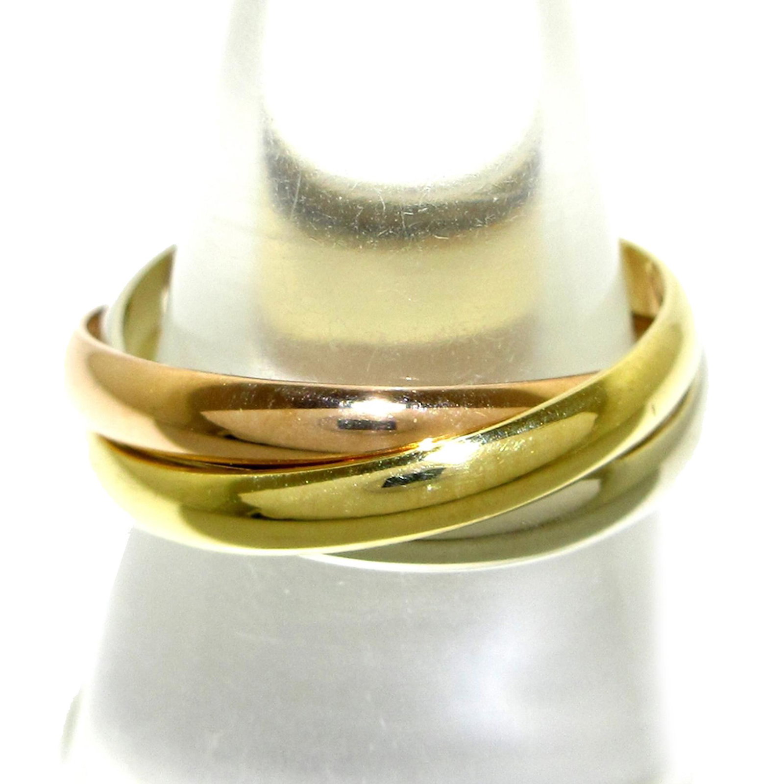 Les Must de Cartier Classic Trinity Ring: Les Must de Cartier Classic Trinity Ring The Trinity ring features tri-tone gold hardware. Weight about 5.0 g. Brand: Cartier Model: Les Must de Cartier Classic Trinity Ring Origin: France Category: J