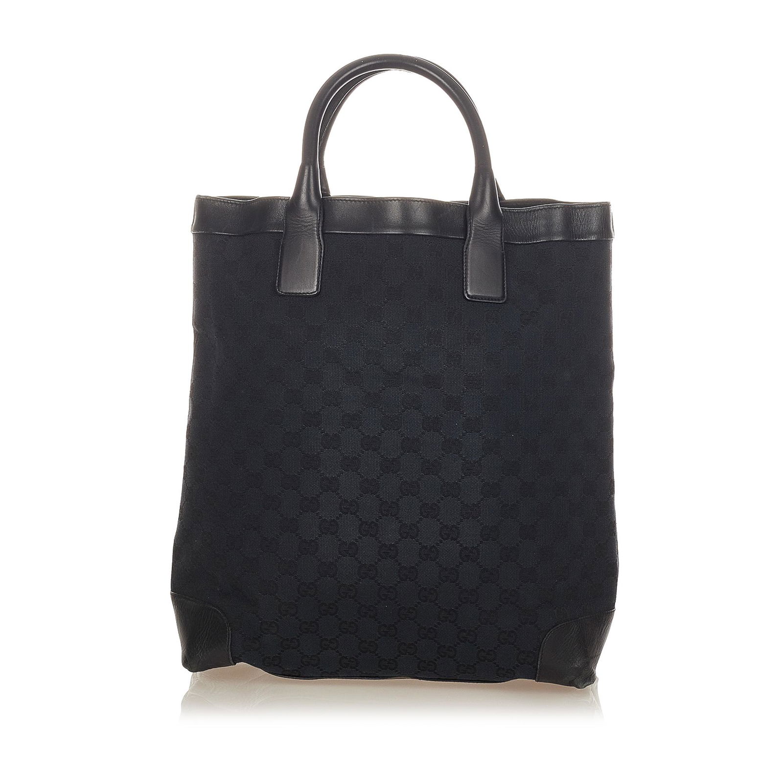 Gucci GG Canvas Tote Bag: Gucci GG Canvas Tote Bag This tote bag features a canvas body with leather trim rolled leather straps an open top and an interior zip pocket. Brand: Gucci Model: GG Canvas Tote Bag Origin: Italy Categ