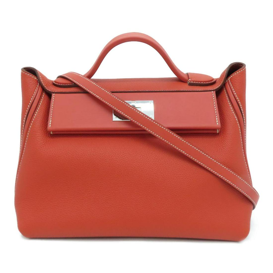 HERMES 24/24 Sanguine Taurillon Clemence: HERMES 24/24 Sanguine Taurillon Clemence Brand: HERMES Category: Women:Handbag Color: Sanguine Dimensions: H:21cm x W:27cm x D:13cm Shoulder Strap (cm) : 74 / Z/Sanguine / ZHT 638 The BIDHAUS Guarante