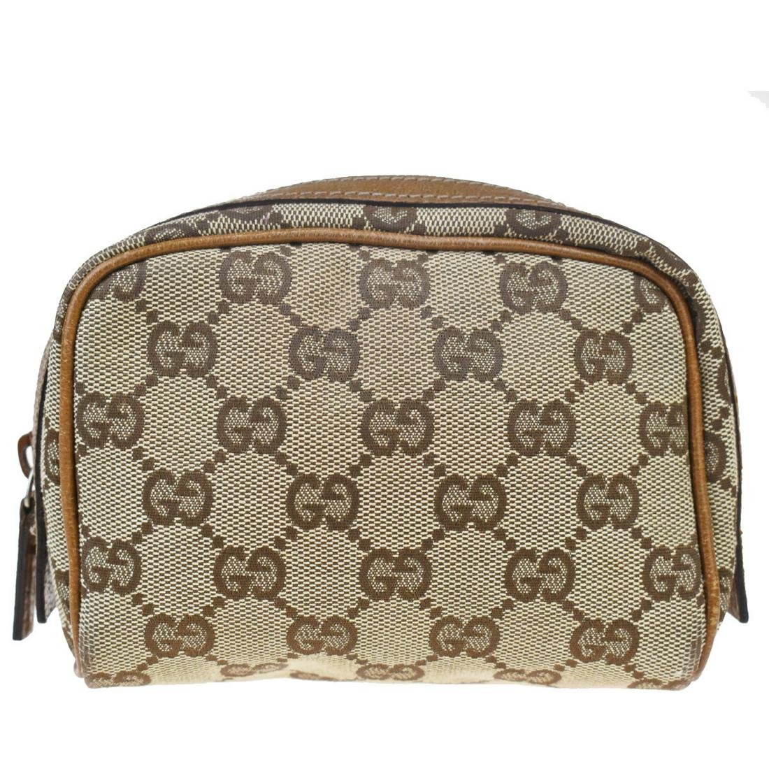Gucci GG Canvas Canvas,Leather Pouch Brown: Gucci GG Canvas Canvas,Leather Pouch BrownBrand: Gucci Line: GG Canvas Type: Pouch Accessories: None Condition: Used (acceptable) Material: Canvas, Leather Color: Brown Size (HxWxD): 11cm x 13cm x 6cm