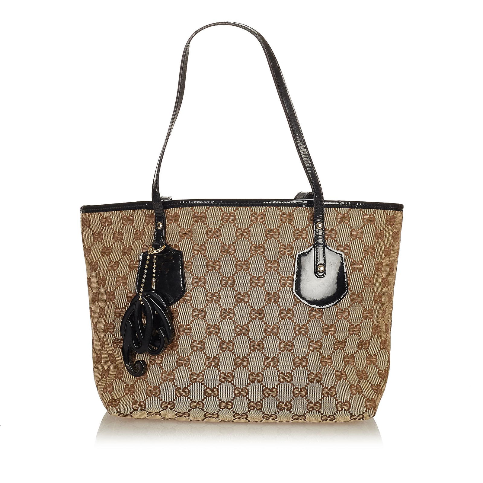 Gucci GG Canvas Jolie Tote Bag: Gucci GG Canvas Jolie Tote Bag The Jolie tote bag features a canvas body with leather trim flat leather straps an open top and an interior zip pocket. Brand: Gucci Model: GG Canvas Jolie Tote Bag Orig
