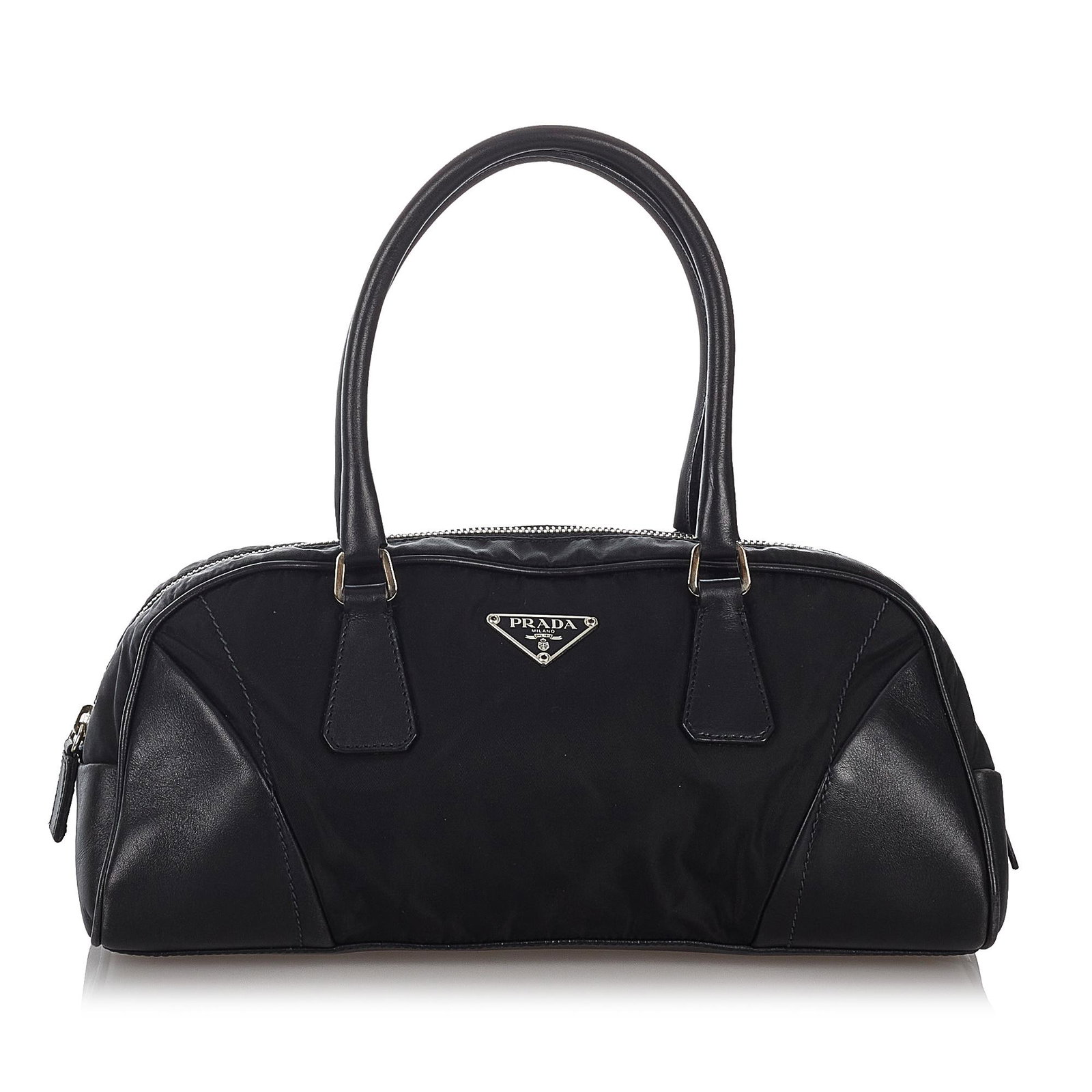 Prada Tessuto Handbag: Prada Tessuto Handbag This handbag features a nylon body with leather trim rolled leather handles a top zip closure and an interior zip pocket. Brand: Prada Model: Tessuto Handbag Origin: Italy Catego