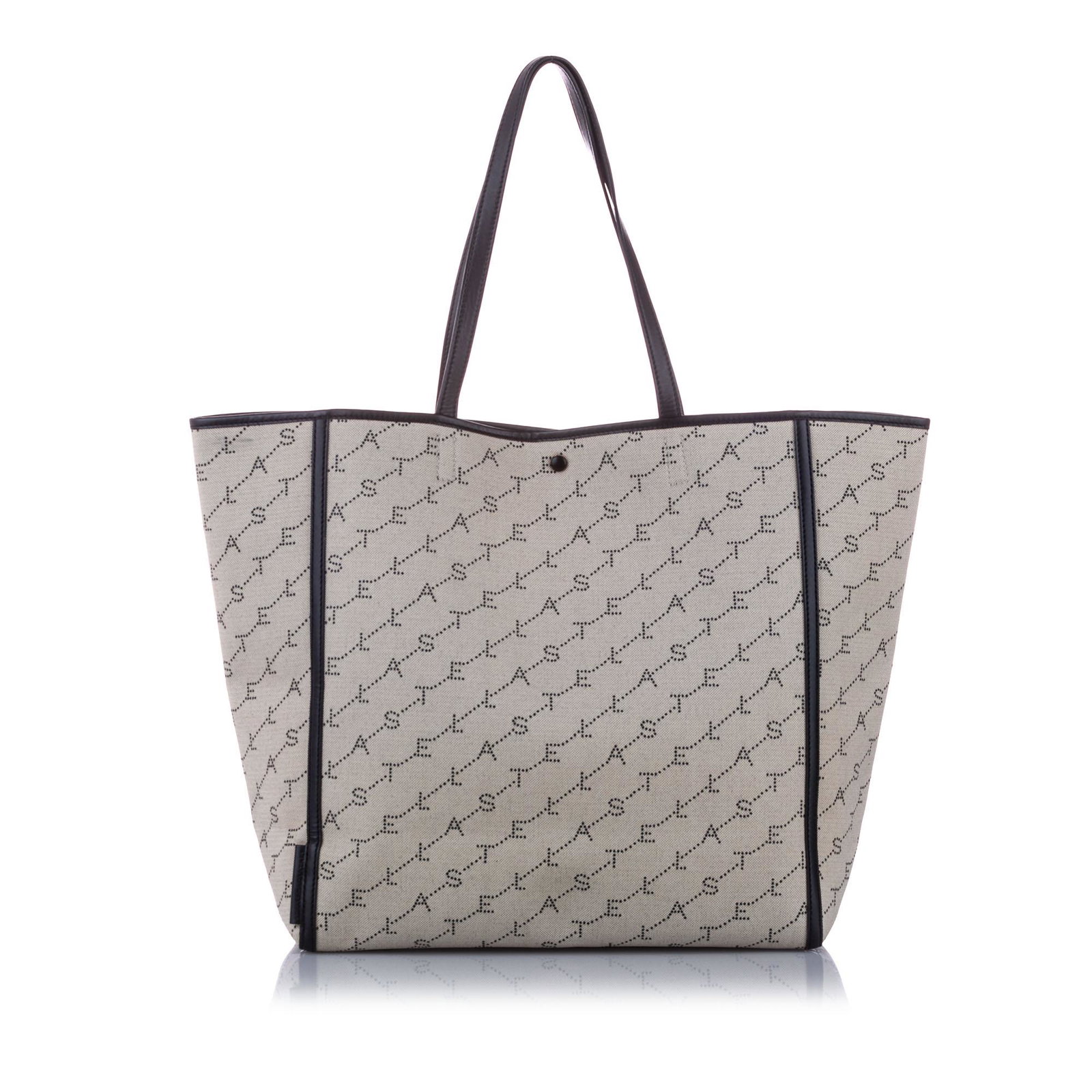 Stella McCartney Monogram Canvas Tote Bag: Stella McCartney Monogram Canvas Tote Bag This tote bag features a canvas body flat straps an open top with a magnetic snap button closure and interior zip and slip pockets. Brand: Stella McCartney Mo