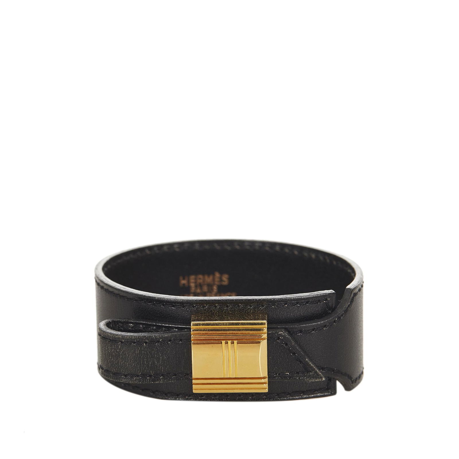 Hermes Cadenas Leather Bracelet: Hermes Cadenas Leather Bracelet The Cadenas bracelet features a leather body and a cadena lock charm. Brand: Hermes Model: Cadenas Leather Bracelet Origin: France Category: Costume Color: Black Style: