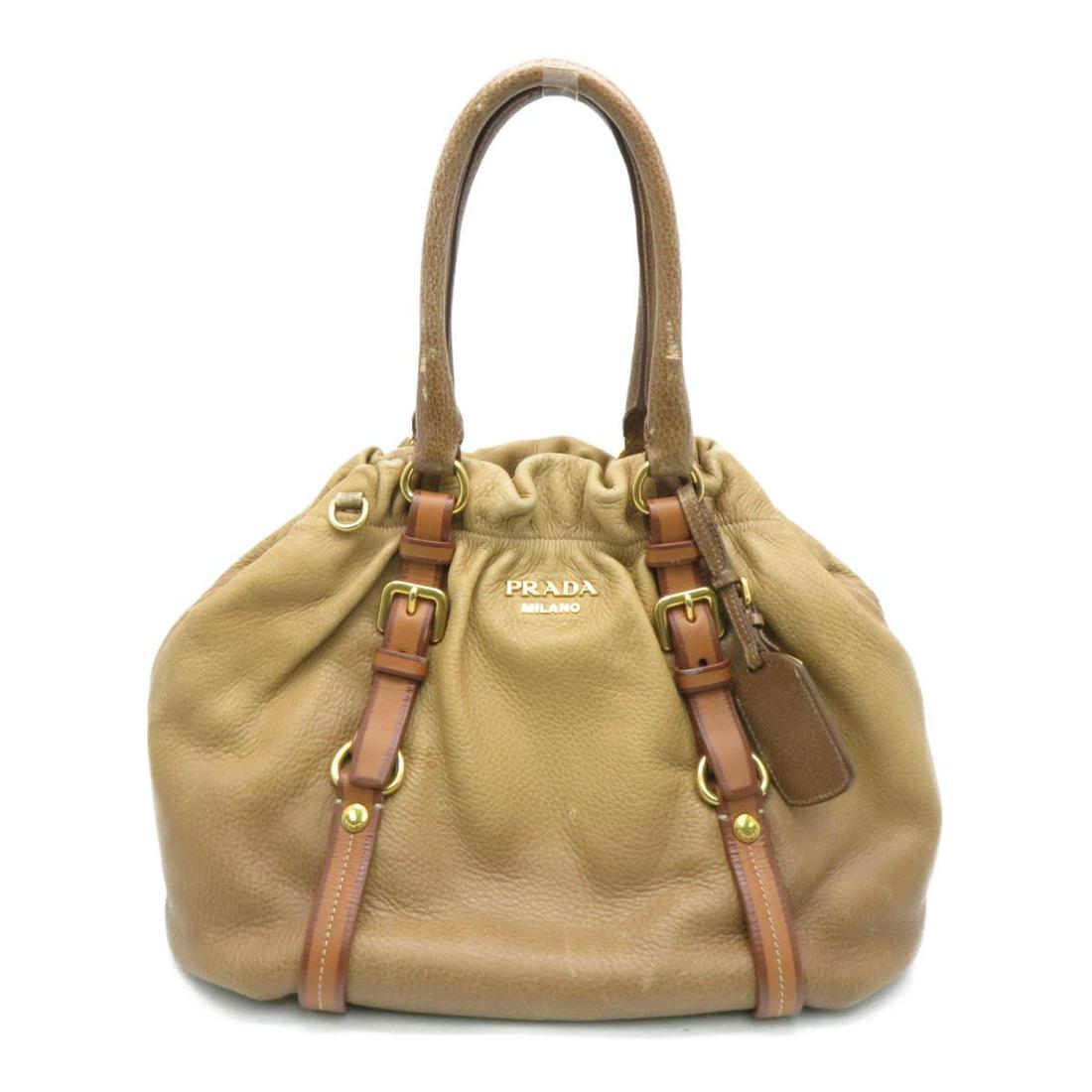 PRADA 2 Way Bag Brown Cervo: PRADA 2 Way Bag Brown Cervo Brand: PRADA Model: PRADA 2 Way Bag Brown Cervo Category: Women:Handbag Color: Brown Dimensions: H:29cm x W:32cm x D:14cm Shoulder Strap (cm) : 96 / BN1773 The BIDHAUS Guar