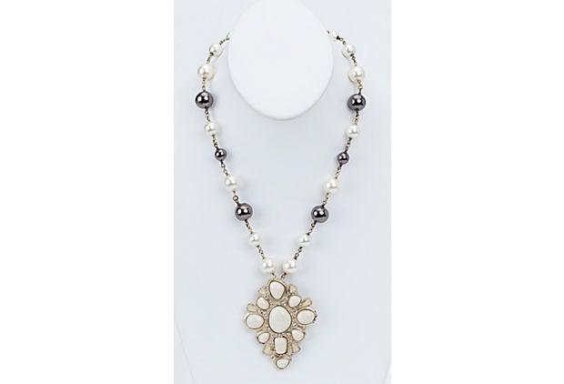 Chanel White & Gray Pendant Necklace: Chanel White & Gray Pendant Necklace Condition: Very Good; minor tarnish on clasp Era: Contemporary; 2000s Dimensions: 19.5" L x 1" W Materials: metal glass enamel Color: white cream gray gold Chanel 