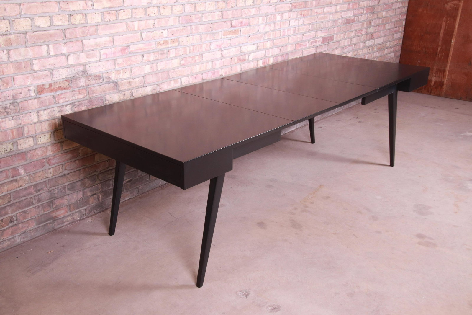 Vladimir Kagan for Grosfeld House Mid-Century Modern: Vladimir Kagan for Grosfeld House Mid-Century Modern Black Lacquered Extension Dining Table Newly Refinished An exceptional mid-century modern black lacquered walnut extension dining table By Vladimir