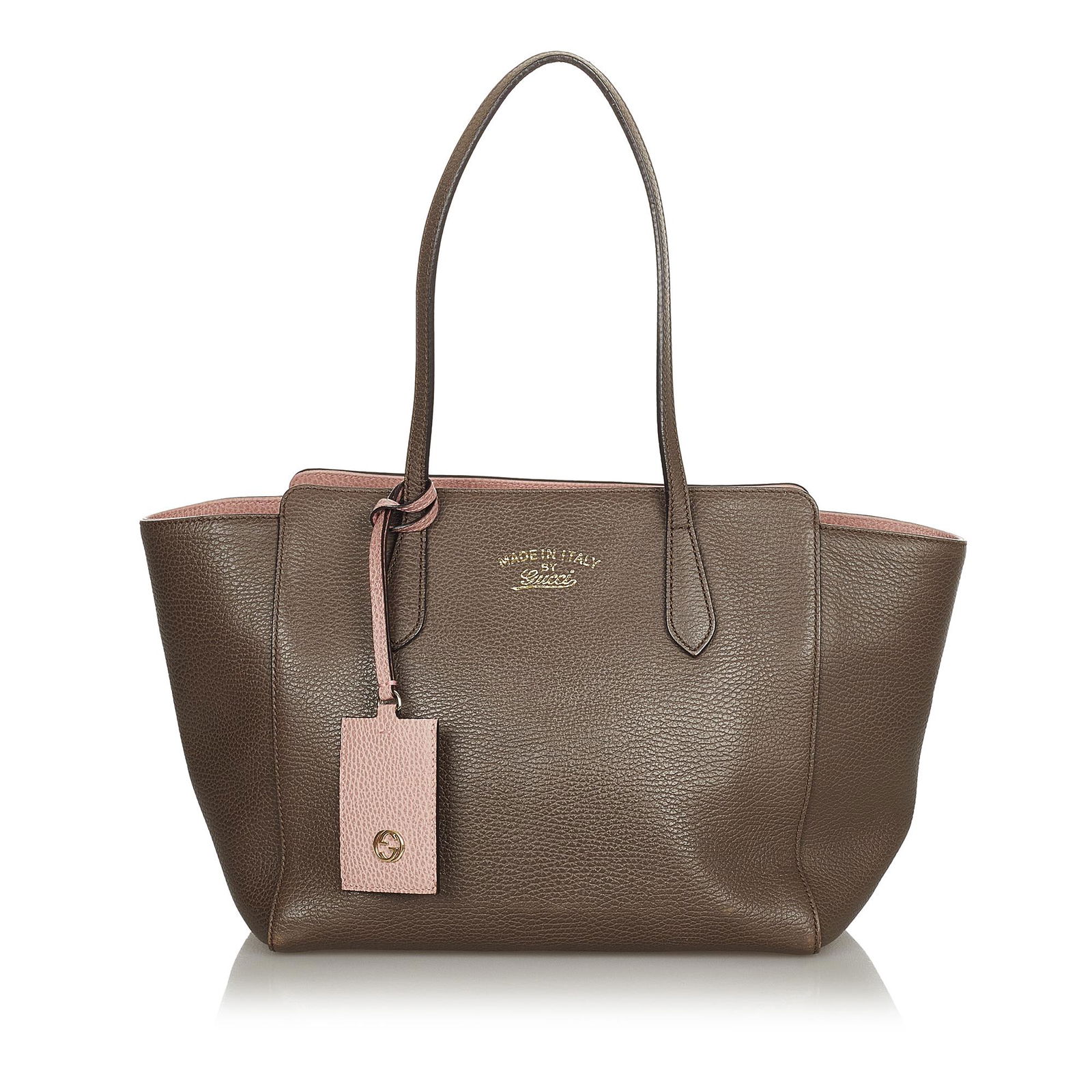 Gucci Swing Leather Tote Bag: Gucci Swing Leather Tote Bag The Swing features a leather body flat leather shoulder straps a top magnetic closure and interior zip and slip pockets. Brand: Gucci Model: Swing Leather Tote Bag Origin: