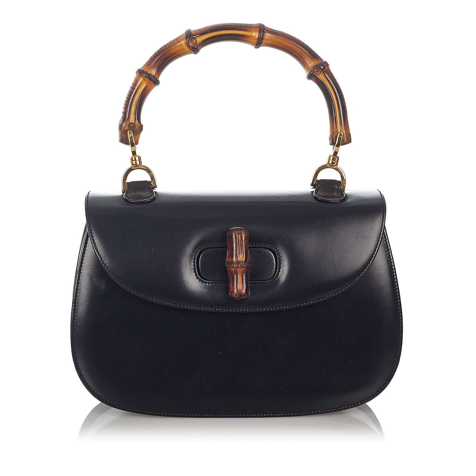 Gucci Bamboo Night Leather Handbag: Gucci Bamboo Night Leather Handbag This handbag features a leather body a bamboo top handle a front flap with a bamboo twist lock closure and interior zip and slip pockets. Brand: Gucci Model: Bamboo
