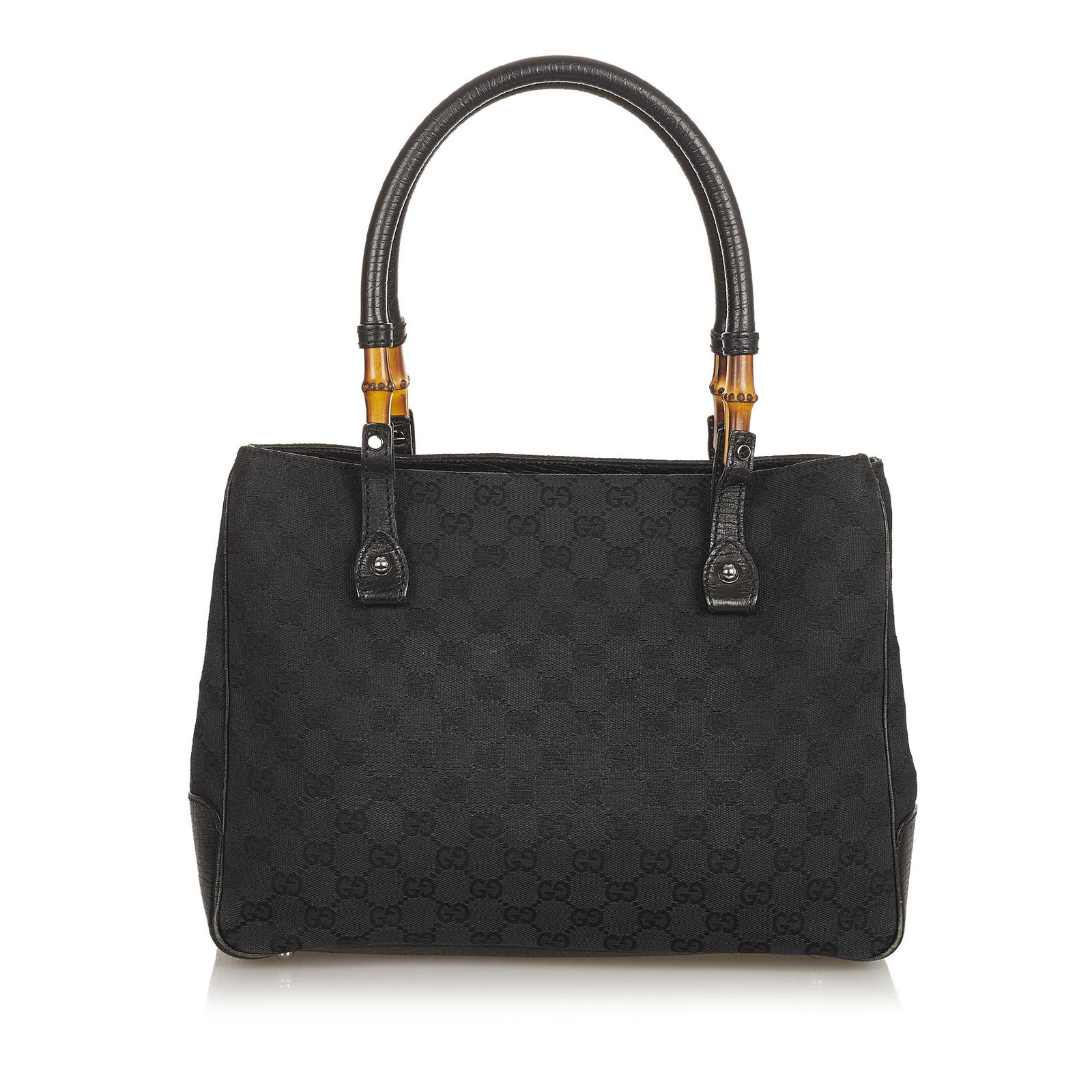 Gucci Bamboo GG Canvas Handbag: Gucci Bamboo GG Canvas Handbag This handbag features a canvas body with leather trim rolled leather handles with bamboo bullet an open top and an interior zip pocket. Brand: Gucci Model: Bamboo GG Can