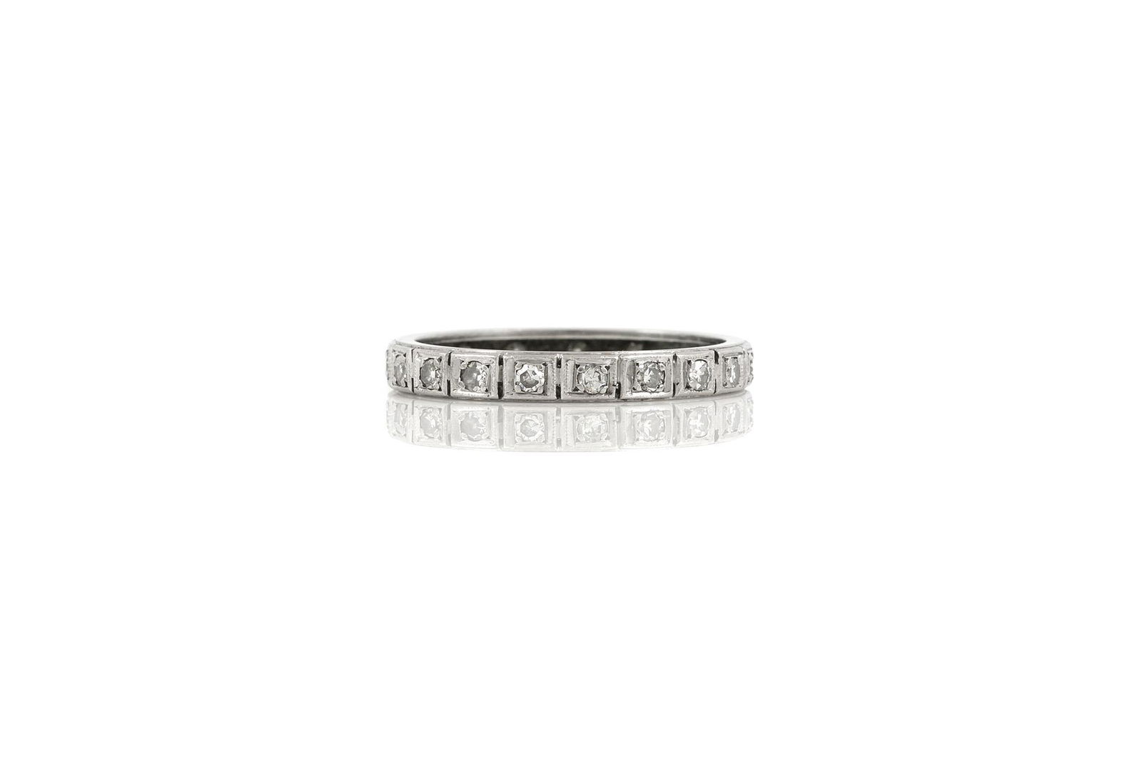 0.70 Carat Antique Wedding Band: 0.70 Carat Antique Wedding Band Antique wedding bands finely crafted in platinum with round brilliant diamonds weighing a total of 0.70 carat. The BIDHAUS Guarantee: All items in this auction are guar