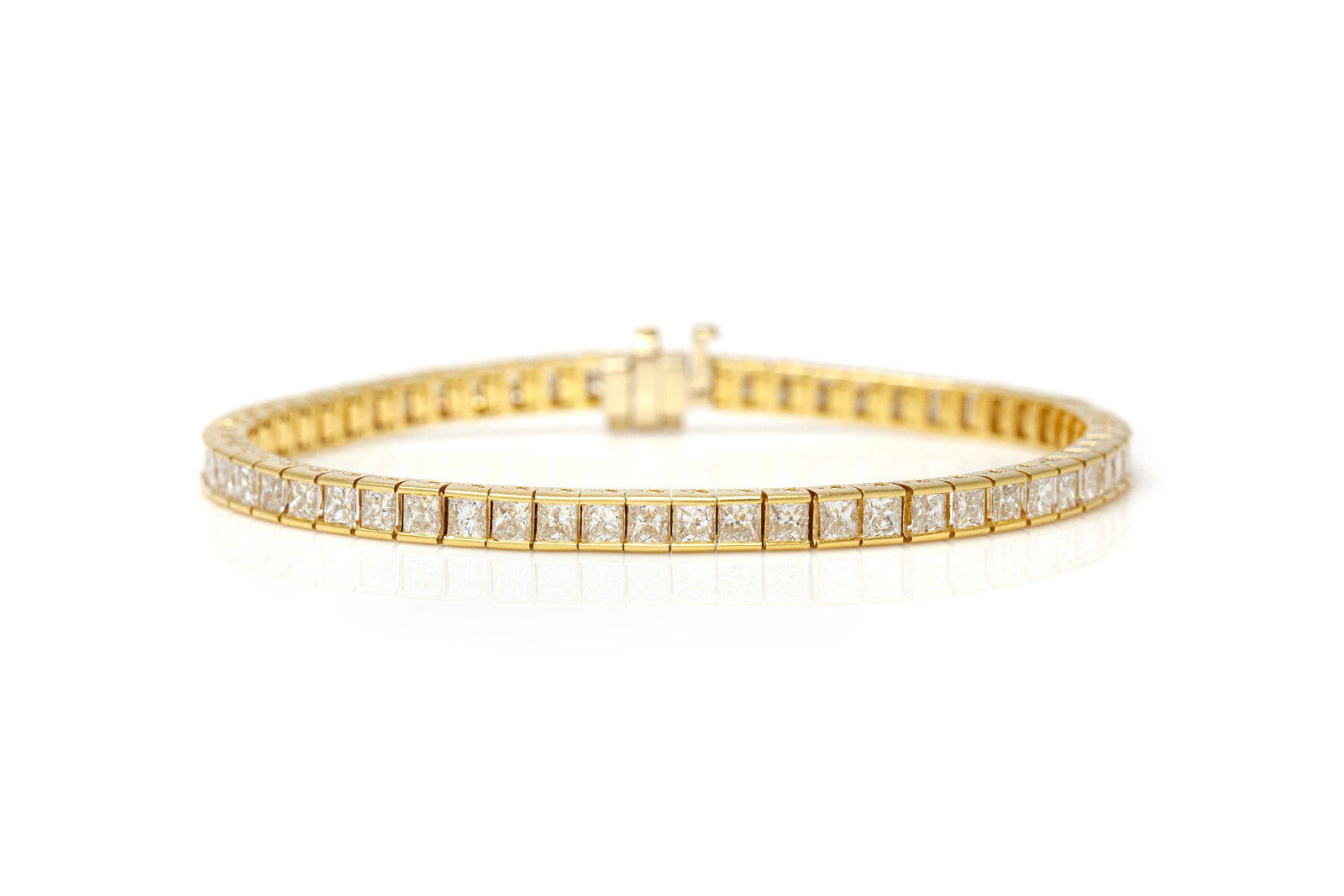 7.85 Carat Princess Cut Channel Set Diamond Tennis: 7.85 Carat Princess Cut Channel Set Diamond Tennis Bracelet Channel tennis bracelet finely crafted in 18k yellow gold with princess cut diamonds weighing a total of 7.85 carat. Length of the bracelet 