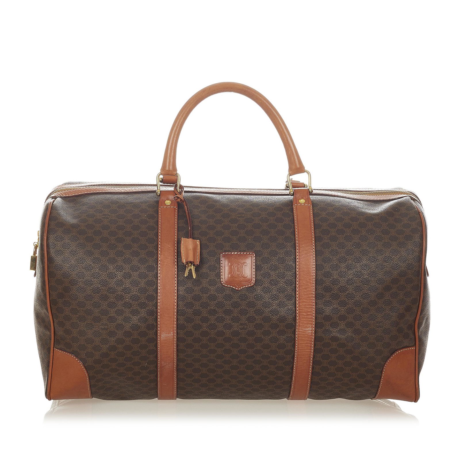 Celine Macadam Travel Bag: Celine Macadam Travel Bag This travel bag features a PVC body with leather trim rolled leather handles a top zip closure and an interior zip pocket. Brand: Celine Model: Macadam Travel Bag Origin: Fra