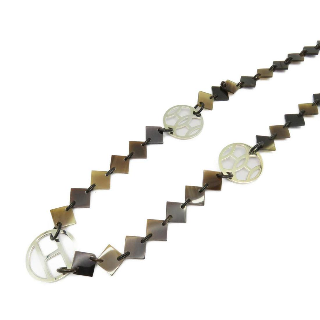 HERMES Lena Brown Buffalo Horn/925: HERMES Lena Brown Buffalo Horn/925 Brand: HERMES Model: HERMES Lena Brown Buffalo Horn/925 Category: Women:Accessory Color: Brown Dimensions: The BIDHAUS Guarantee: All items in this auction are guara