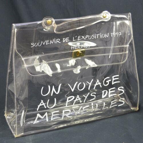 HERMES Vinyl Kelly Beach Hand Bag SOUVENIR DE: HERMES Vinyl Kelly Beach Hand Bag SOUVENIR DE L'EXPOSITION 1997 Exterior Color: Clear Department: Women Strap Drop: 1.6 Exterior Material: Vinyl Bag Height: 12.2 Size: Medium Bag Width: 15.7 Bag Depth