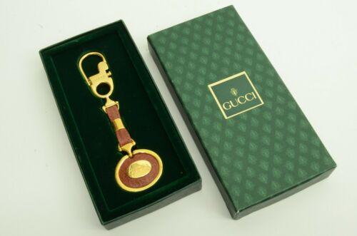 Gucci Leather GP Logo Strap Keychain Pull Hook: Gucci Leather GP Logo Strap Keychain Pull Hook Accessory w Vintage Accents: Logo Character: Logo Department: Women Material: Gold Plated Leather Theme: Classic Chic Luxury Logo Type: Key Chain Feature