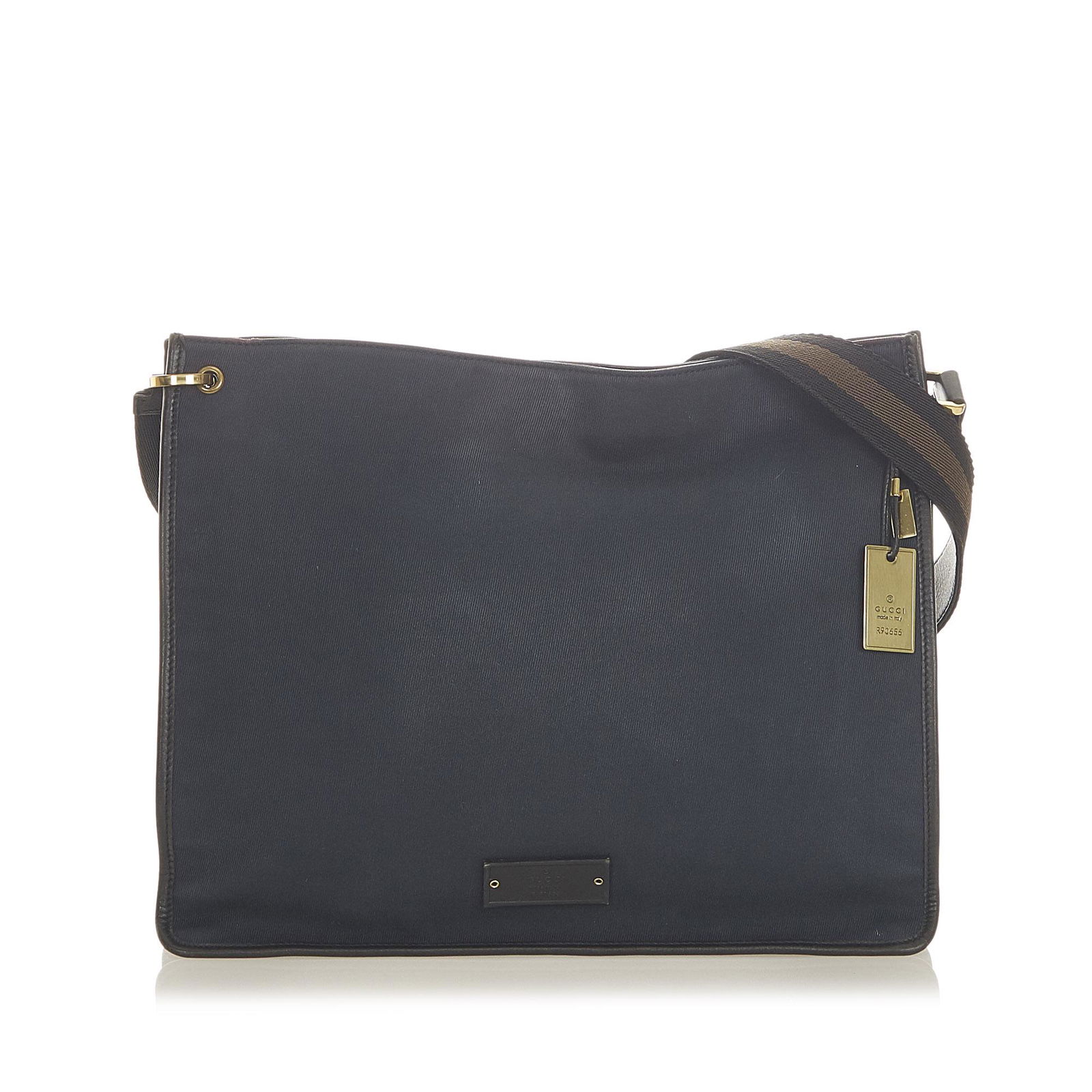 Gucci Canvas Crossbody Bag: Gucci Canvas Crossbody Bag This crossbody bag features a canvas body with leather trim an adjustable flat strap a top magnetic snap button closure and an interior zip pocket. Brand: Gucci Model: Canva