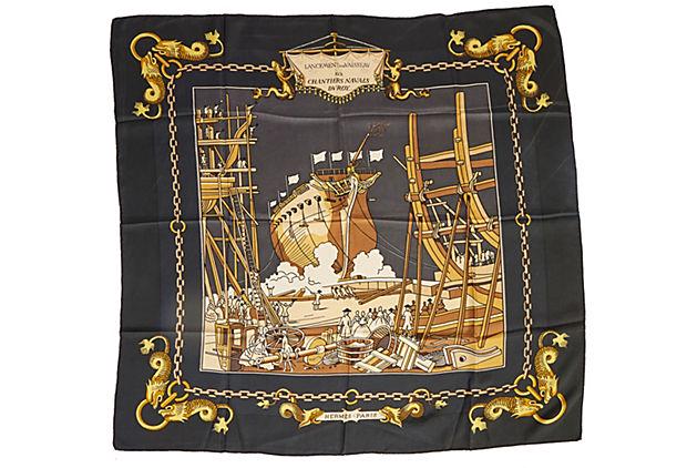 Hermes Black Lancement Silk Scarf: Hermes Black Lancement Silk Scarf Condition: Excellent Era: Contemporary; 1990s Dimensions: 35" L x 35" W Materials: silk Color: black gold Hermes "lancement d'un vaisseau aux Chantiers Navals du Roi"