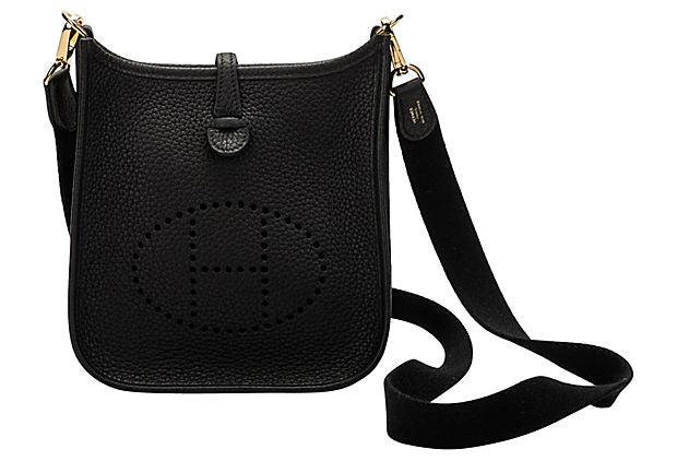 Hermes Black Mini Evelyne Bag: Hermes Black Mini Evelyne Bag Condition: New Era: Contemporary; 2000s Dimensions: 8" L x 2" W x 6.5" H Materials: leather/metal/fabric Color: black/gold Hermes mini Evelyne shoulder bag in black Tauri