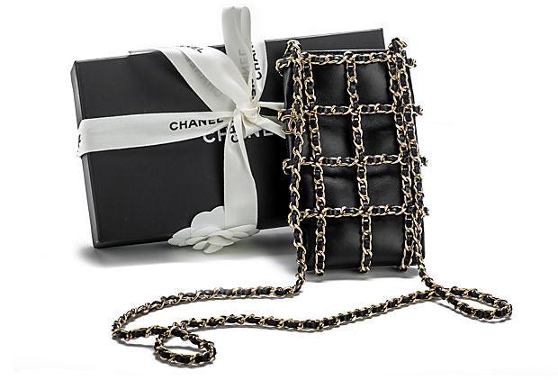 Chanel Cell Phone Case Black Gold: Chanel Cell Phone Case Black Gold Condition: New Era: Contemporary; 2000s Dimensions: 6.75" L x 0.5" W x 3.75" H Materials: leather metal Color: black gold Brand new in box collectible cross body bag.