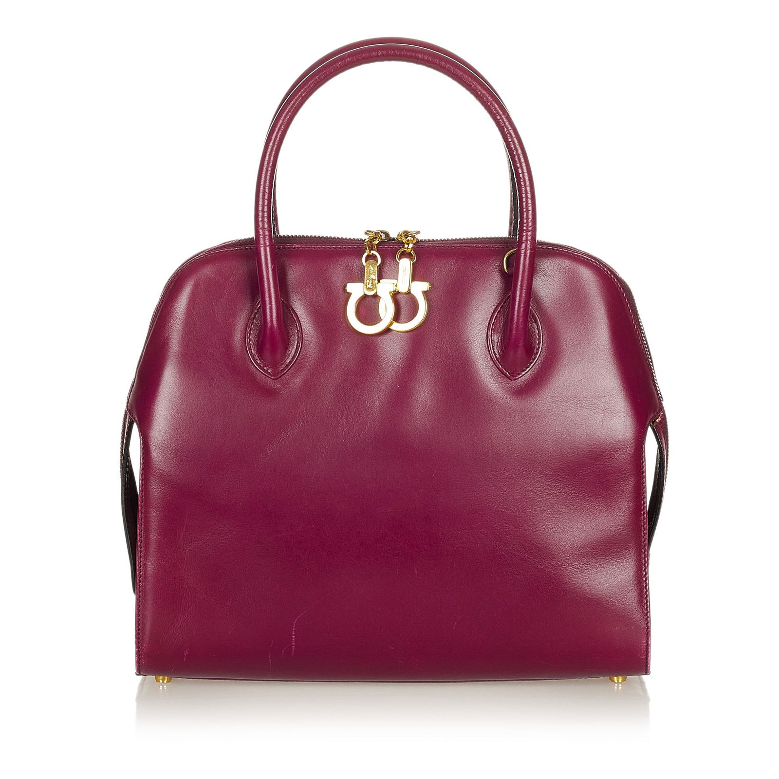 Ferragamo Gancini Leather Satchel: Ferragamo Gancini Leather Satchel This satchel features a leather body rolled leather handles a detachable strap a top zip closure and interior zip pockets. Brand: Ferragamo Model: Gancini Leather Sat