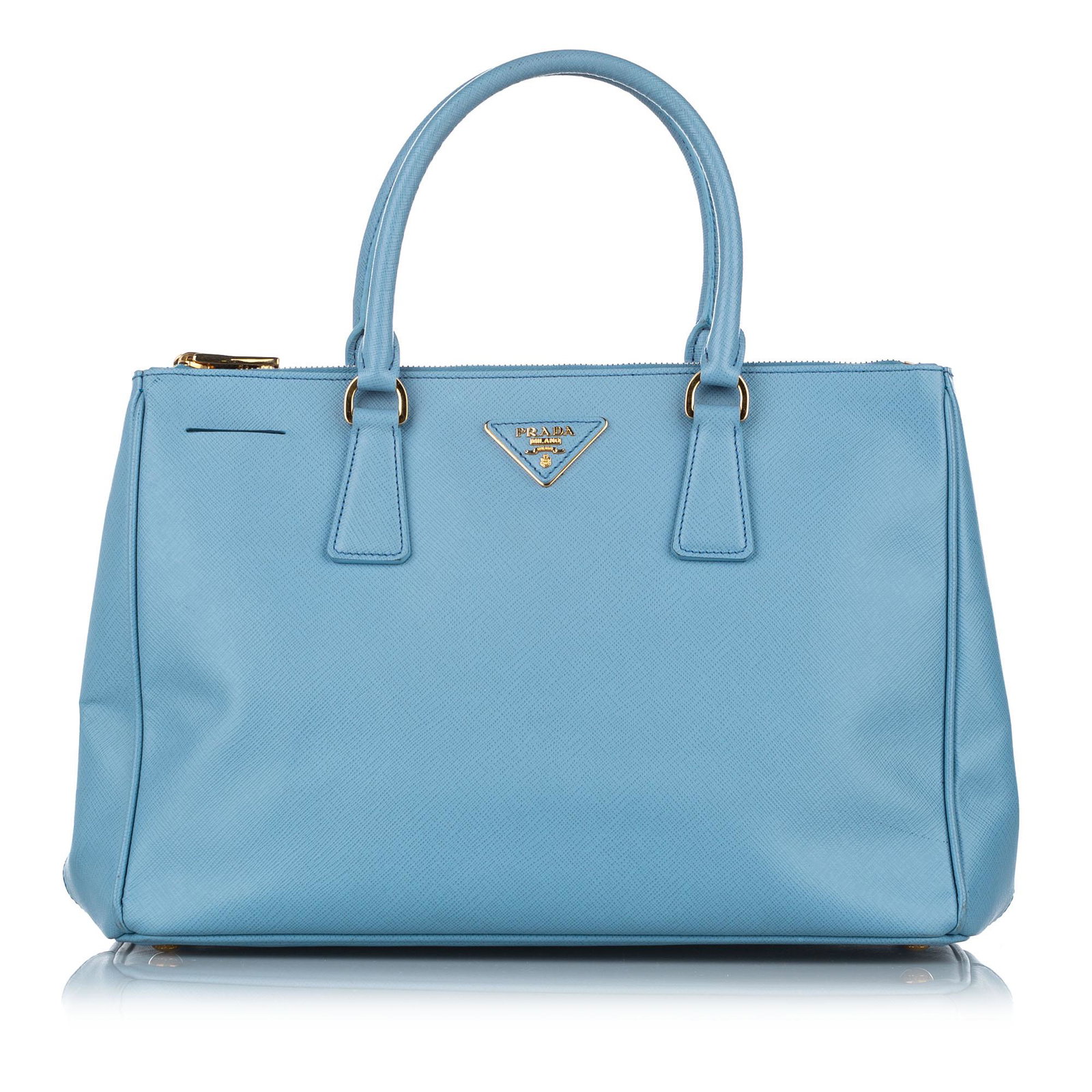 Prada Saffiano Galleria Handbag: Prada Saffiano Galleria Handbag The Galleria handbag features a saffiano leather body rolled leather handles an open top with magnetic snap button closure zip compartments and an interior zip and slip
