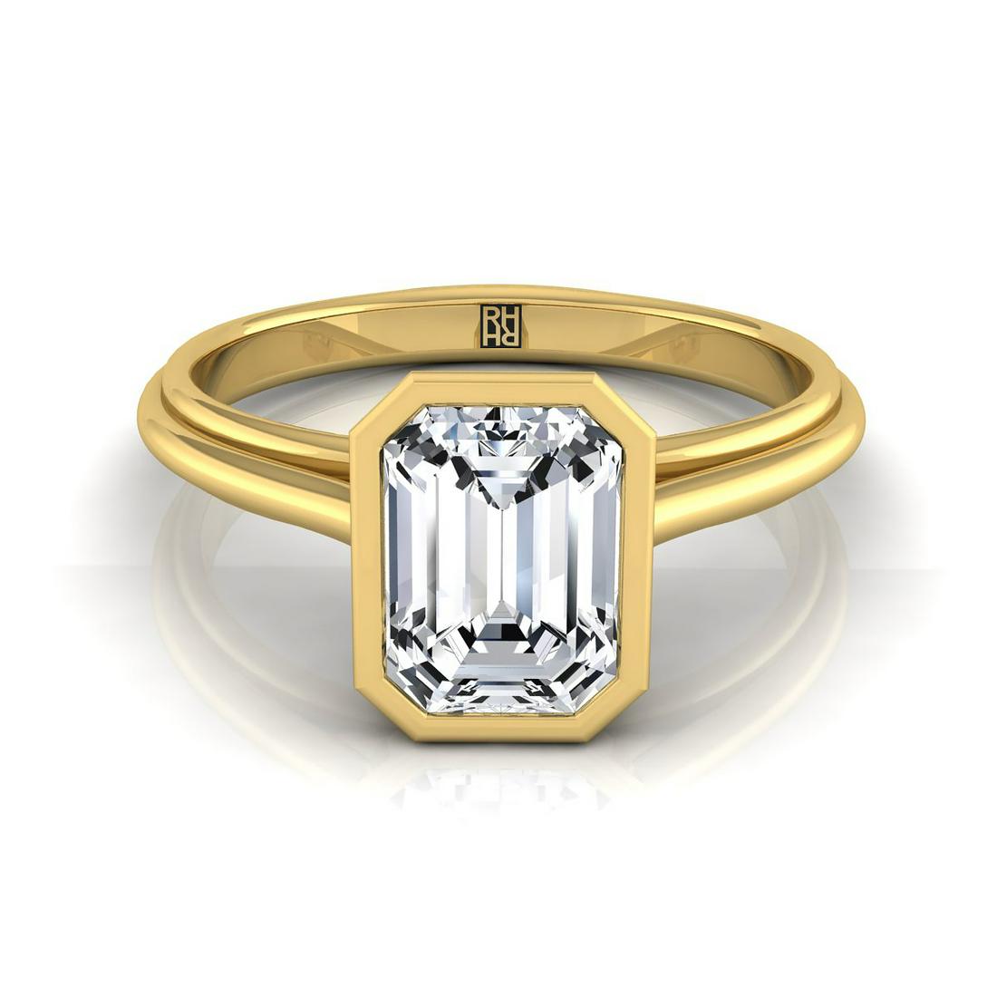 Diamond Emerald Cut Bezel Solitaire Engagement Ring In: 14k Yellow Gold Ring With 1.25ct Emerald Cut Cubic Zirconia Center Style: Engage - SEMI Primary Stone: Cubic Zirconia Gender: Ladies Metal:14K Yellow Gold Country of Origin: USA Dimensions (LxWxH in m