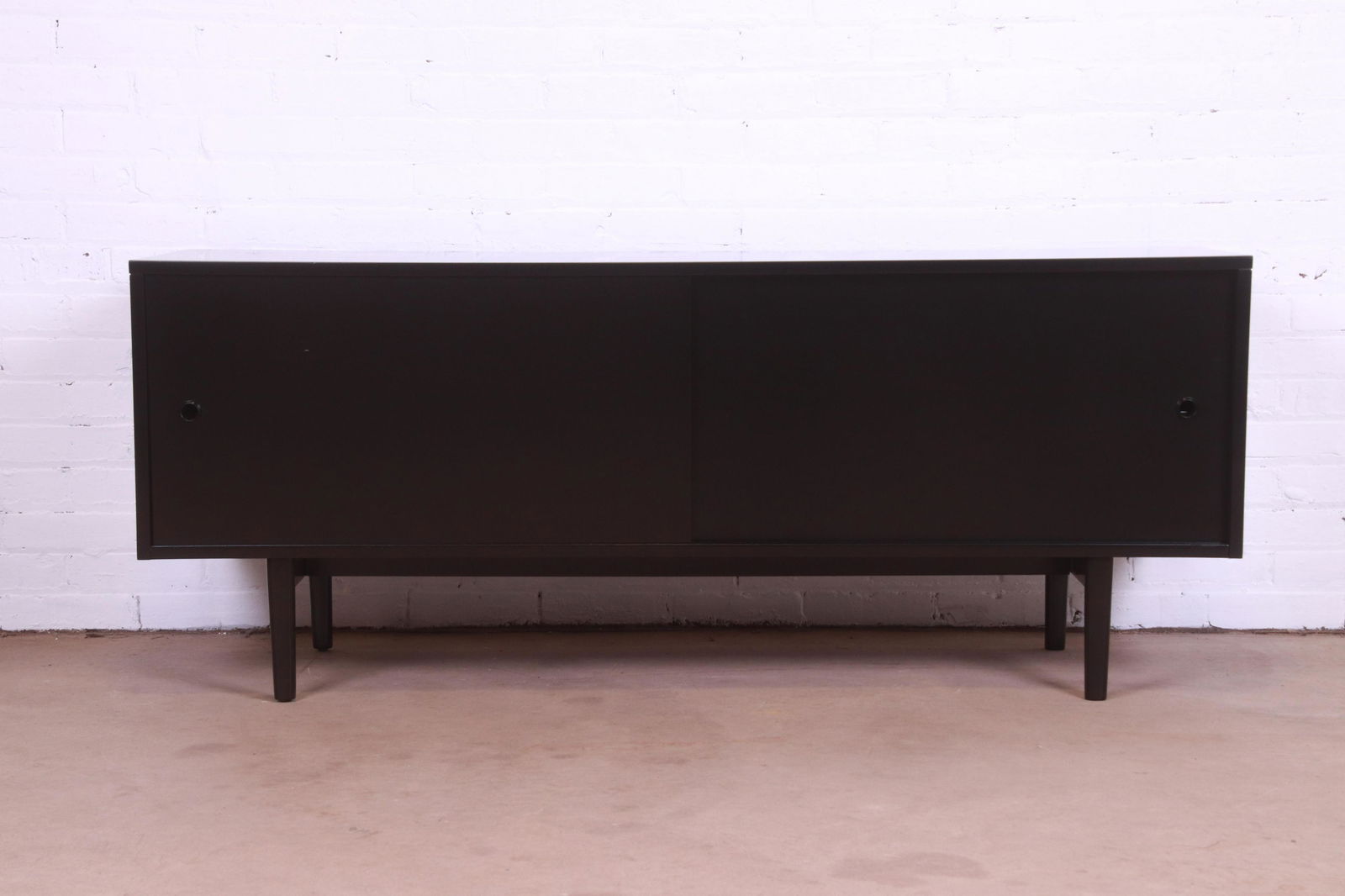 Paul McCobb Planner Group Mid-Century Modern Black: Paul McCobb Planner Group Mid-Century Modern Black Lacquered Credenza or Record Cabinet Newly Refinished An exceptional minimalist mid-century modern sliding door credenza or record cabinet By Paul Mc