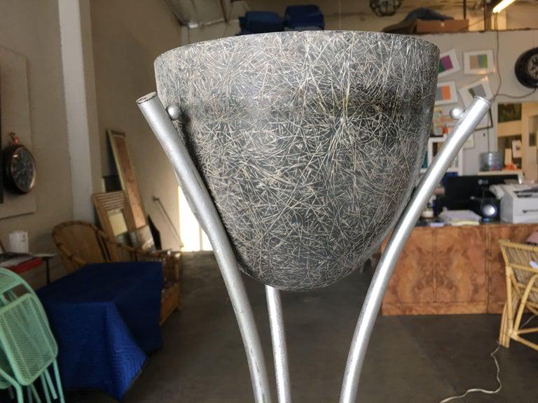 Grey Spun Fiberglass Planter on Silver-Tone Wrought: Grey Spun Fiberglass Planter on Silver-Tone Wrought Iron Wire Tripod Base Dimensions: Height: 28 in. (71.12 cm) Dimensions: Diameter: 10 in. (25.4 cm) Materials and Techniques: Aluminum Materials and 