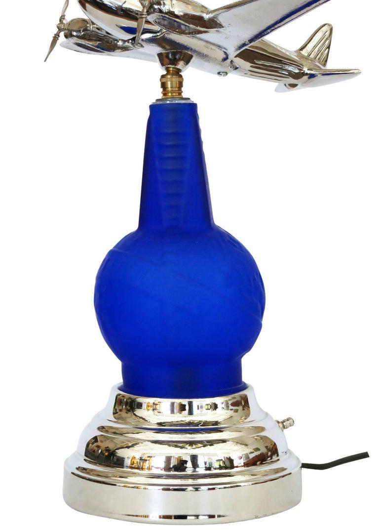 1939 World's Fair Light Up Bottle Airplane Lamp: 1939 World's Fair Light Up Bottle Airplane Lamp Dimensions: Height: 16 in. (40.64 cm) Dimensions: Width: 14 in. (35.56 cm) Dimensions: Depth: 8 in. (20.32 cm) Style: Art Deco (In the Style Of) Materia