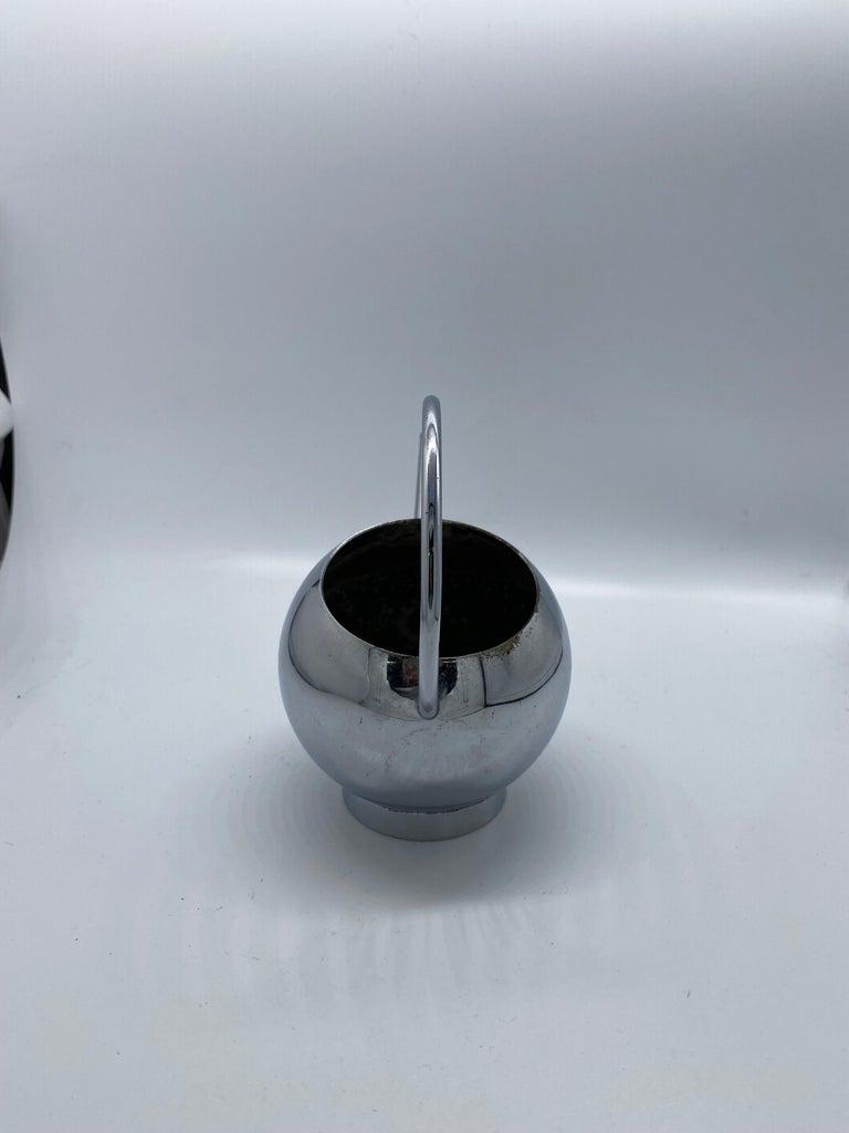 1934 Modernist Small Chrome Syrup Pitcher by Russel: 1934 Modernist Small Chrome Syrup Pitcher by Russel Wright for Chase Co. Creator: Chase Brass and Copper Company (Manufacturer) Dimensions: Height: 5.300 in. (13.47 cm) Dimensions: Diameter: 2 in. (5.