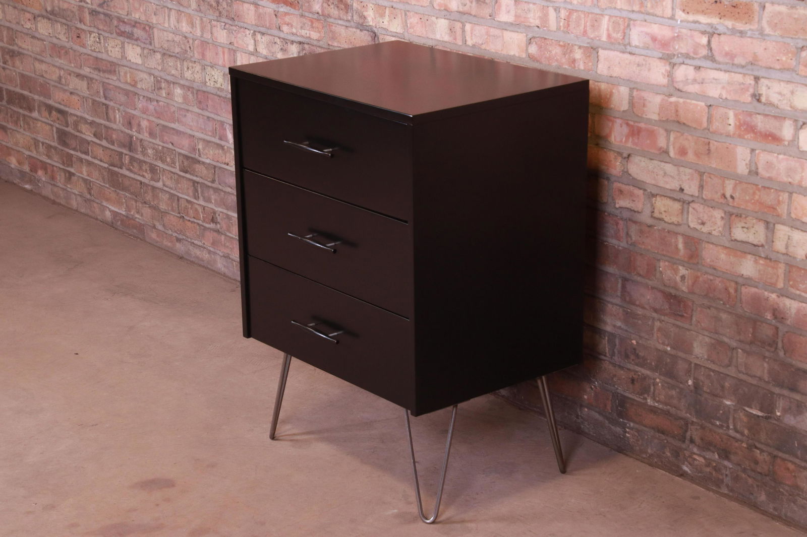 Paul McCobb Planner Group Black Lacquered Three-Drawer: Paul McCobb Planner Group Black Lacquered Three-Drawer Chest on Hairpin Legs Newly Refinished A sleek and stylish mid-century modern chest of drawers on hairpin legs By Paul McCobb for Winchendon Furn