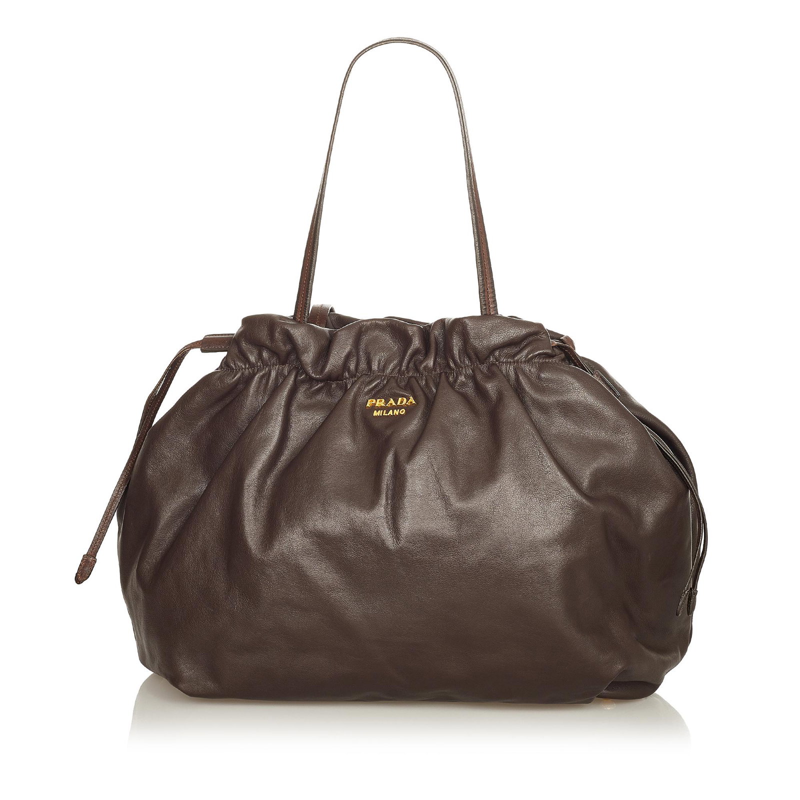 Prada Leather Drawstring Tote Bag: Prada Leather Drawstring Tote Bag This tote bag features a leather body flat leather straps a top magnetic snap closure and side drawstring details and interior zip and slip pockets. Brand: Prada Mode