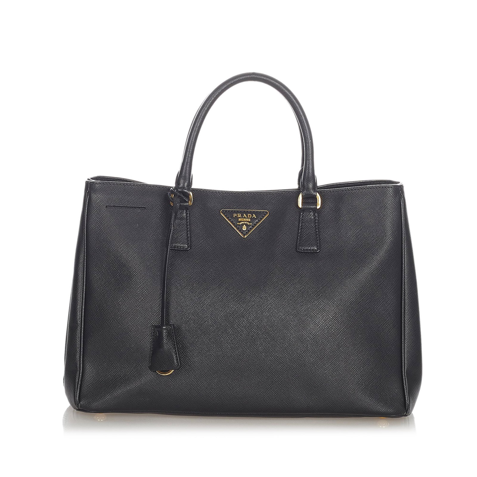 Prada Saffiano Galleria Tote Bag: Prada Saffiano Galleria Tote Bag The Galleria features a saffiano leather body rolled leather handles an open top with a magnetic snap button closure and interior zip and slip pockets. Brand: Prada Mo