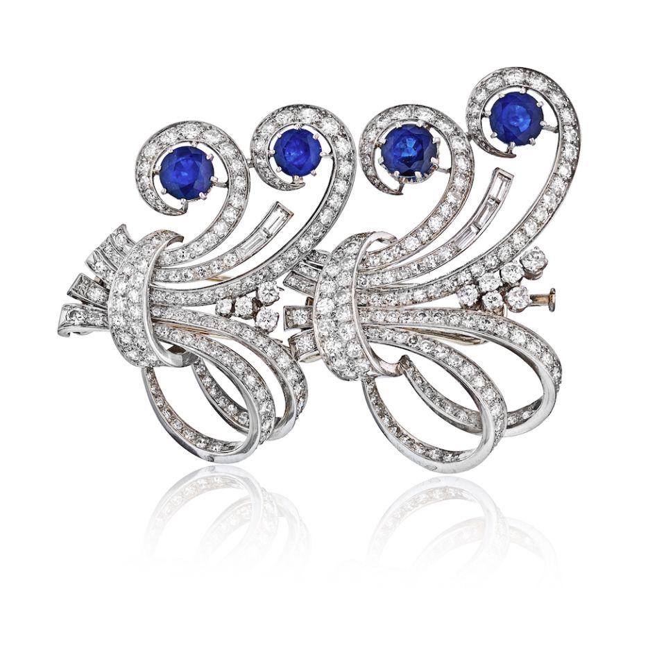 Art Deco Platinum 1930's French Sapphire & Diamond Brooch: Art Deco Platinum 1930's French Sapphire & Diamond Brooch Type: Brooches Metal: Platinum Grams: 43.6 Approximate Diamond Weight: 9 Cts Measurements: L: 3 inches Condition: Very Good. Style: Art Deco O