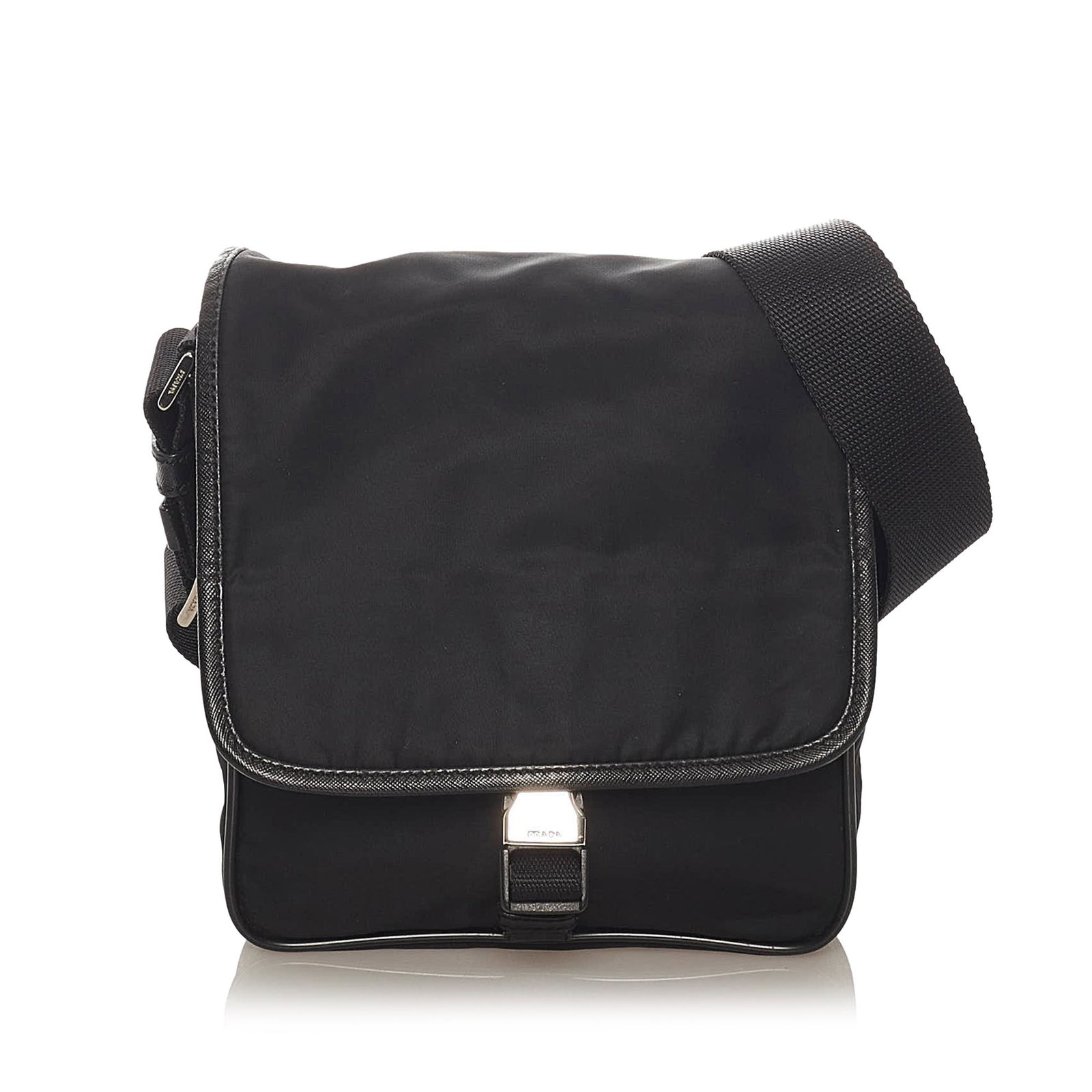 Prada Tessuto Crossbody Bag: Prada Tessuto Crossbody Bag This crossbody bag features a nylon body with leather trim an adjustable flat strap and a front flap. Brand: Prada Model: Tessuto Crossbody Bag Origin: Italy Category: Bags