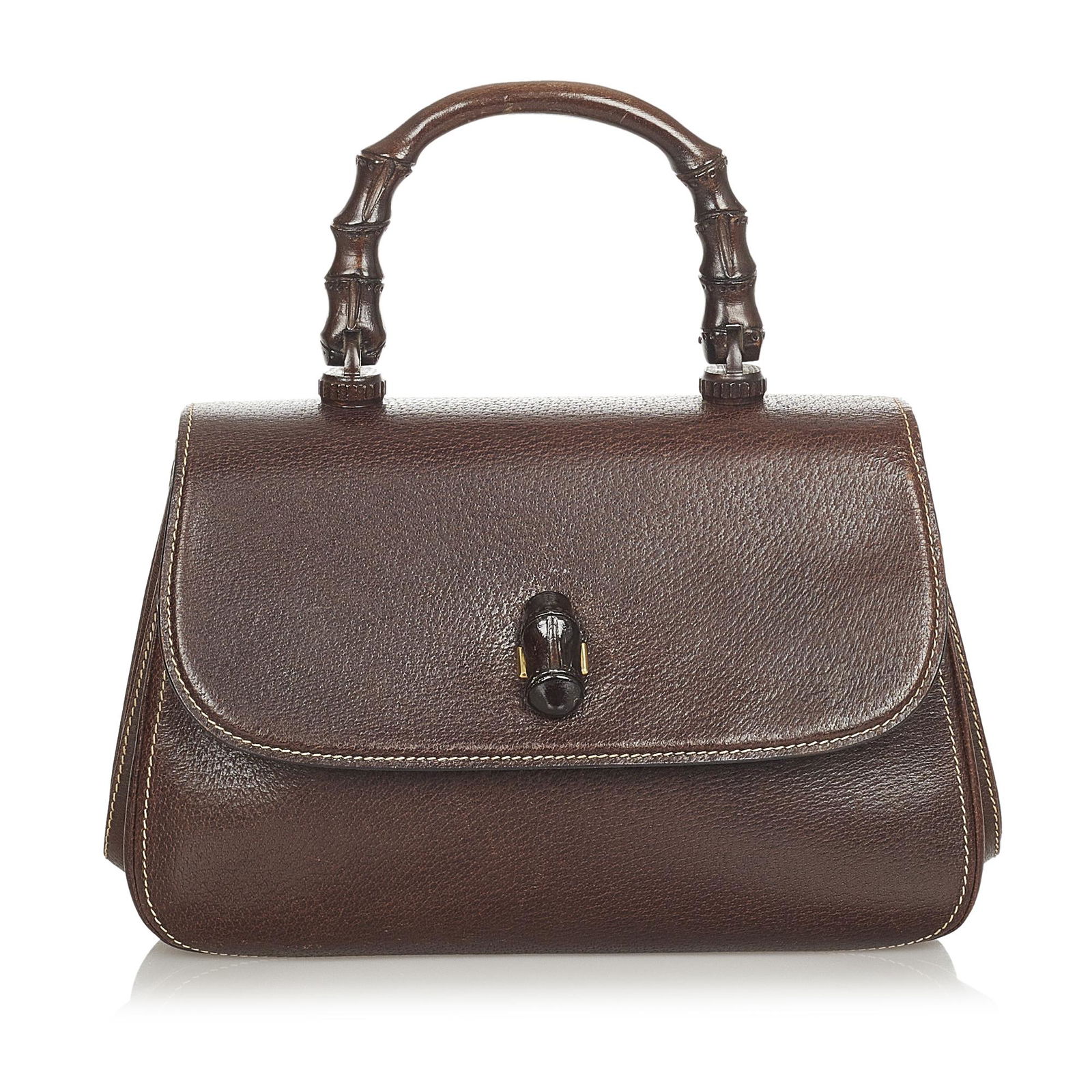 Gucci Bamboo Leather Handbag: Gucci Bamboo Leather Handbag This handbag features a leather body a wood top handle a front flap with a bamboo bullet twist lock closure and interior zip and slip pockets. Brand: Gucci Model: Bamboo L