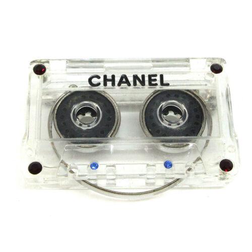 CHANEL CC Cassette Tape Motif Brooch Pin Corsage Plastic Clear 04P: CHANEL CC Cassette Tape Motif Brooch Pin Corsage Plastic Clear 04P Department: Women Material: Plastic Type: Brooch Color: Clear Year Manufactured: 2000-2009 Main Stone: Rhinestone Brand: CHANEL Metal